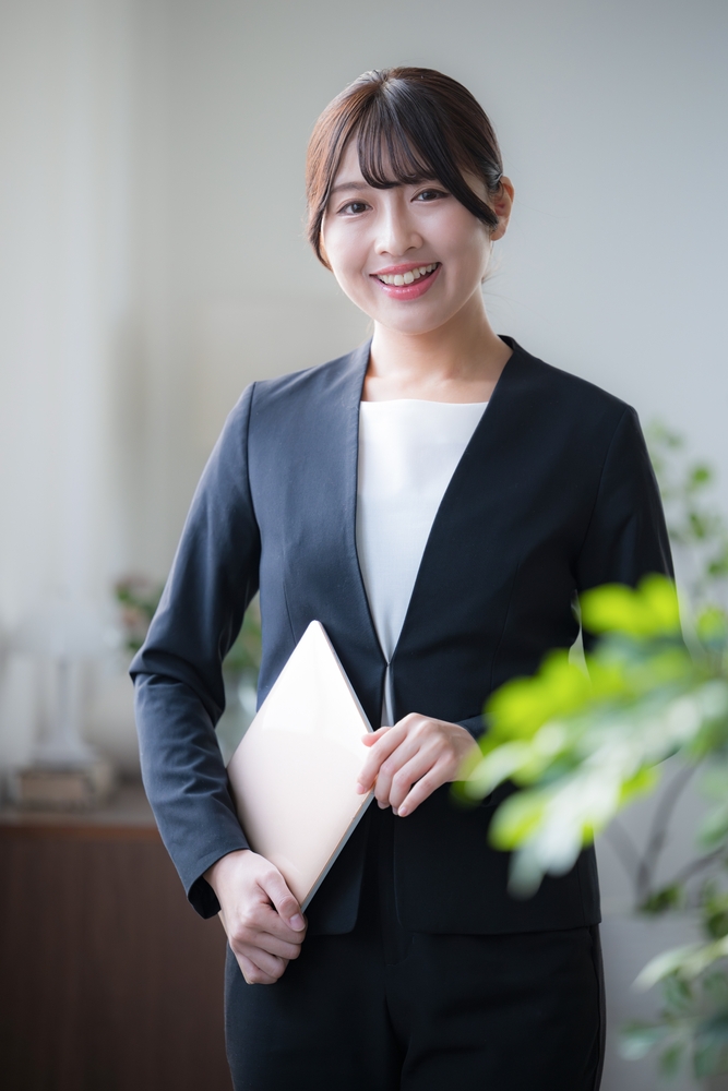 young,businesswoman,with,laptop,in,office,image,camera,eye,view