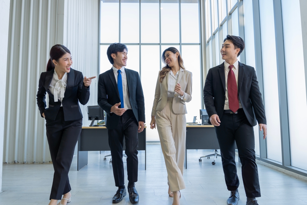 a,group,of,young,asian,businessmen,talking,and,planning,work